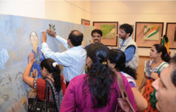 The visually impaired as well as sighted trying to explore and appreciate art by Hasabnis 