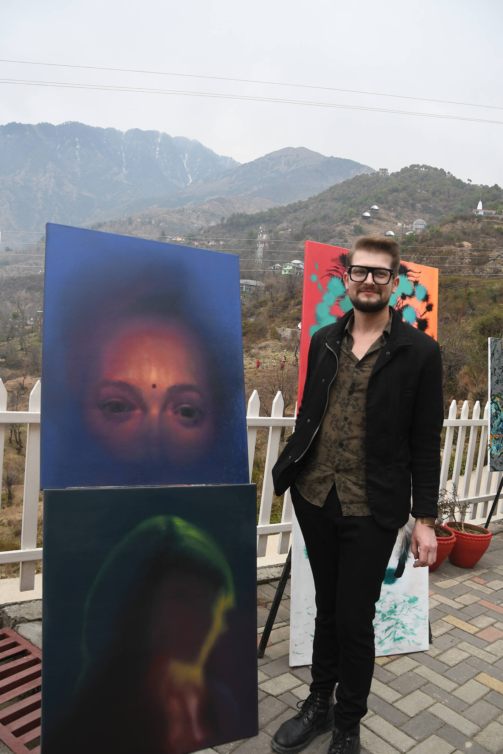 Tomasz Wiktor poses with his art works