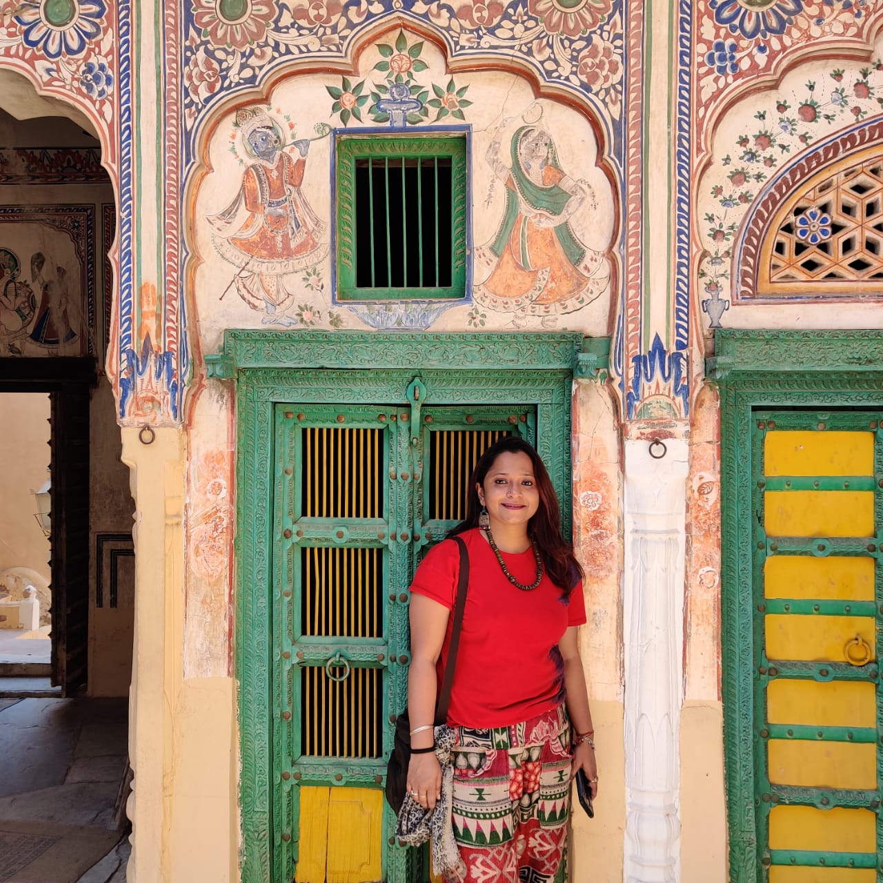 The author posing outside an ornately designed haveli