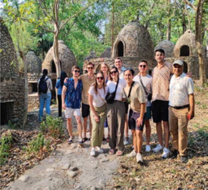 Gusain showing the visitors around Chaurasi Kutia also