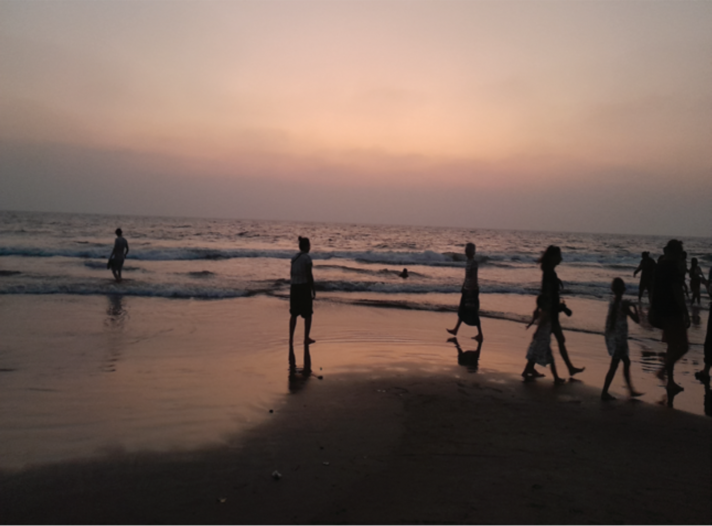 Tourists at Vagator Beach after sunset